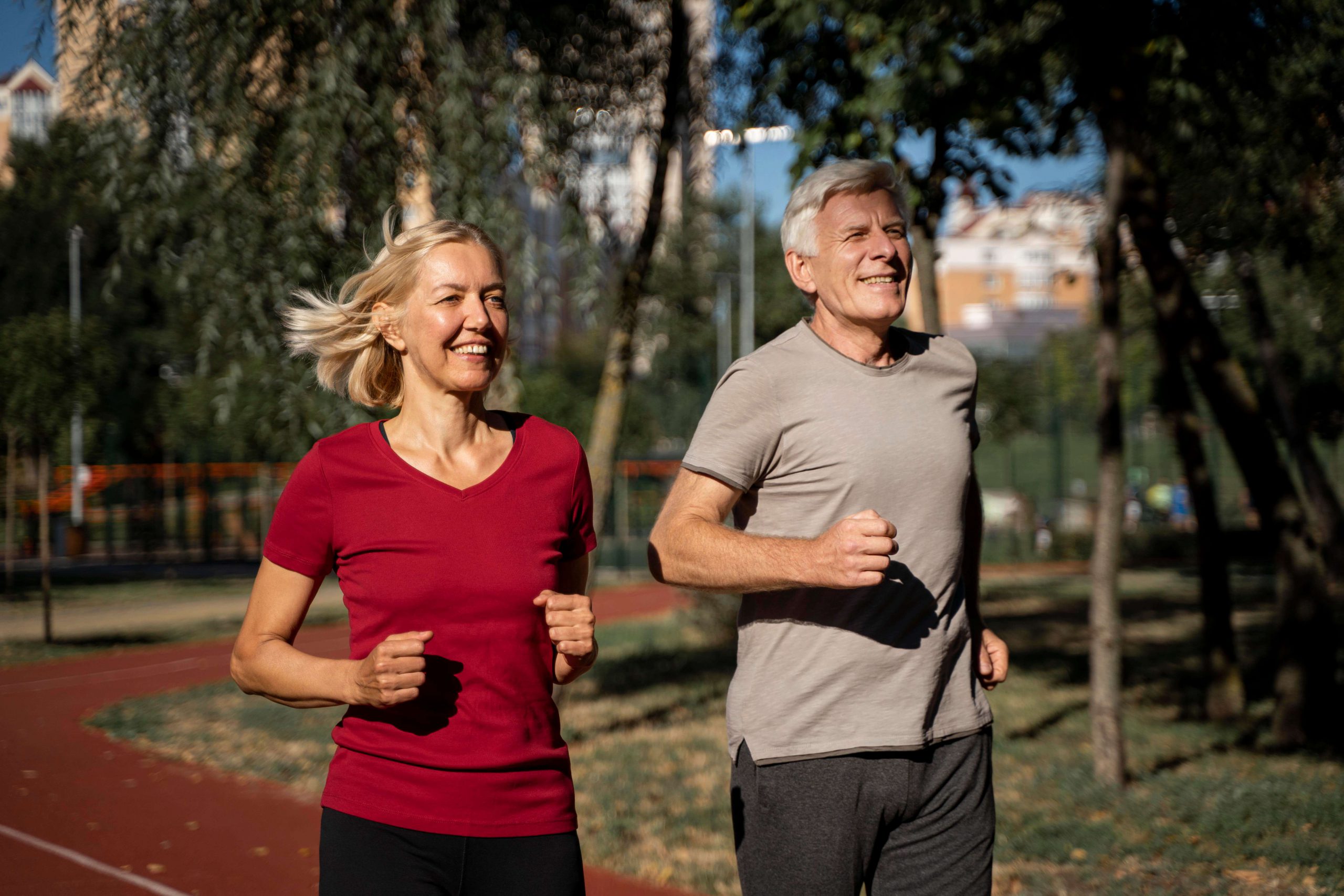 smiley-older-couple-jogging-outdoors (1)